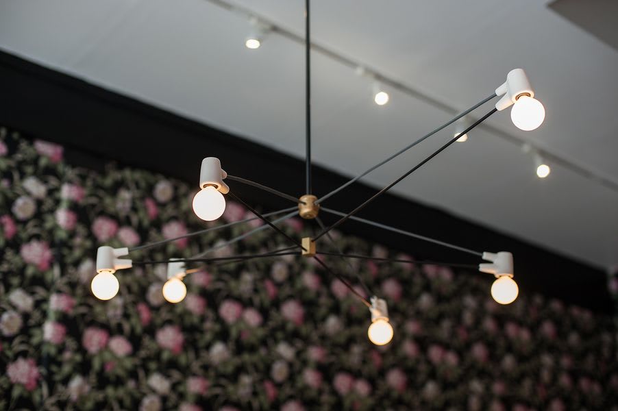 Close up of Cord Chandelier as lighting fixture by creator Brendan Ravenhill in Alfred Coffee cafe space in Los Angeles.