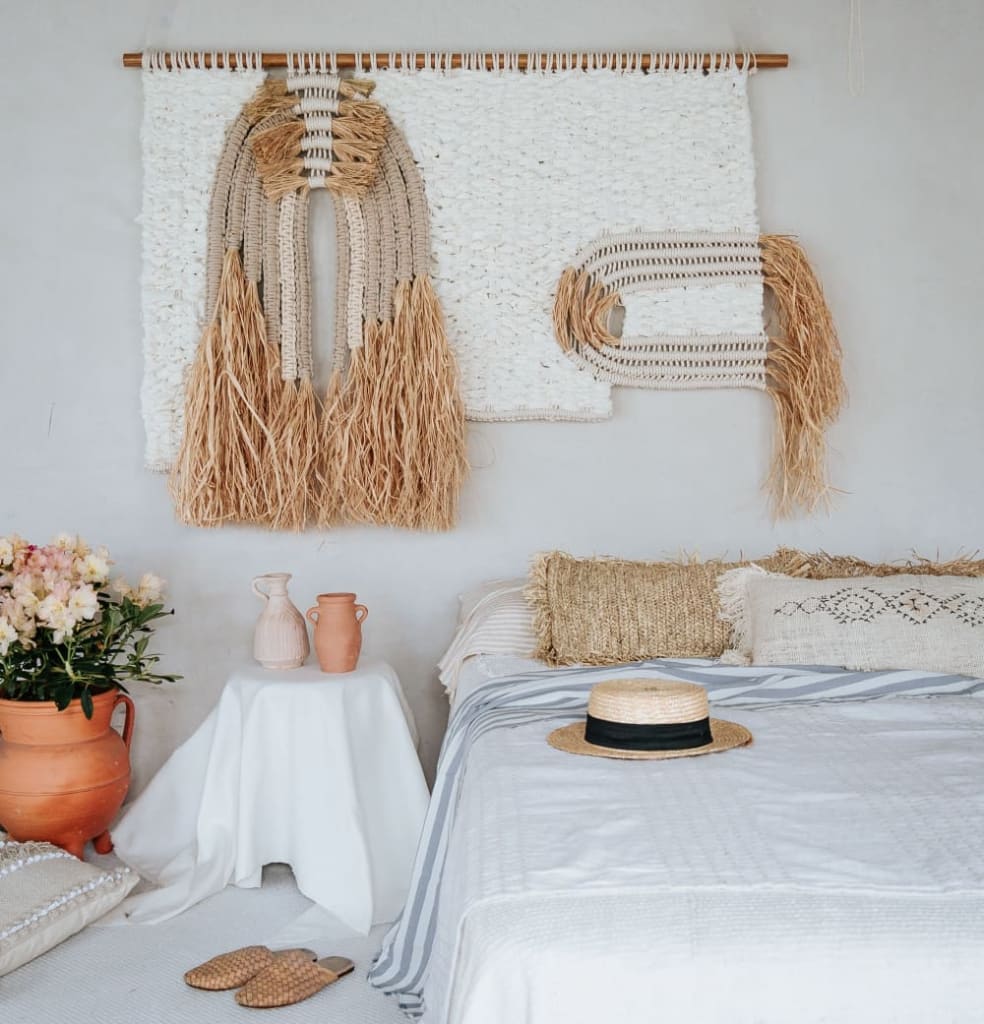 A natural macrame wall hanging by Belen Senra at Ranran Design on Wescover combines natural cotton and raphia fibers for a Eco-Friendly Home Living.