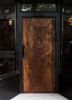 Custom-carved Wood Door | Furniture by Tyler Speir Bradford | Nightbird in San Francisco