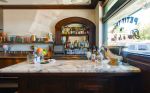 Carrera Marble-topped Wood Bar | Tables by Estee Stanley | Petit Trois in Los Angeles