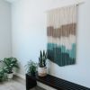 Large Teal Macrame Wall Hanging & Fiber Art | Wall Hangings by Love & Fiber | Rush Creek Lodge at Yosemite in Groveland. Item composed of cotton & fiber