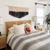 Large Modern Black Triangle Macrame Wall Hanging | Wall Hangings by Love & Fiber. Item composed of cotton and fiber
