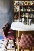 Red Tufted Bar Stools - Model 7030 | Chairs by Richardson Seating Corporation | Maison Pickle in New York. Item composed of wood and leather