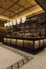 Eventi Hotel Collector’s Shelving System | Storage by Amuneal | Kimpton Hotel Eventi in New York. Item made of wood with metal