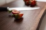 Live edge walnut chef’s block | Serving Board in Serveware by Dust & Spark. Item made of walnut