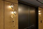 Double Lens Sconce | Sconces by Neptune Glassworks | The Alexandria in San Diego. Item composed of brass and glass