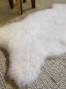 Small White Nursery Pelt | Small Rug in Rugs by East Perry. Item made of fabric