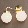 Norwood | Sconces by Illuminate Vintage. Item made of brass & glass