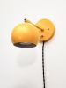 Yellow and Gold Adjustable Sconce - Plug In Wall Pivot Light | Sconces by Retro Steam Works. Item composed of fabric and metal in mid century modern or industrial style