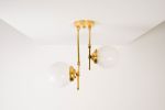Stockton | Chandeliers by Illuminate Vintage. Item made of brass with glass