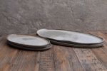 Organic natural shape elongated stoneware plates in grey | Dinnerware by Laima Ceramics. Item made of stoneware compatible with minimalism and contemporary style