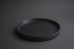 Black matte stoneware saucer/small plate/little dish | Tableware by Laima Ceramics. Item composed of stoneware compatible with minimalism and contemporary style