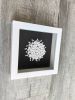 Framed black and white bookshelf decor, white on black wall | Wall Sculpture in Wall Hangings by Art By Natasha Kanevski. Item composed of canvas in minimalism or contemporary style