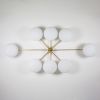 Stella Evening | Chandeliers by DESIGN FOR MACHA. Item made of brass with glass