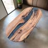 Oval epoxy river dining table | Tables by Ironscustomwood. Item made of walnut