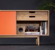 Credenza with Sliding Lacquered Doors | Media Console in Storage by Manuel Barrera Habitables. Item composed of oak wood