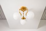 Fremont | Chandeliers by Illuminate Vintage. Item composed of brass and glass