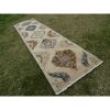 Vintage Organic Wool Tribal Style Faded Turkish Runner Rug | Rugs by Vintage Pillows Store. Item made of cotton