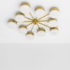 Celeste Epoch | Chandeliers by DESIGN FOR MACHA. Item composed of brass and glass