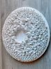 White wall sculpture on a 14" round canvas, wreath art | Wall Hangings by Natasha Kanevski. Item composed of wood & fabric compatible with minimalism and contemporary style