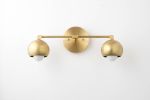 Mid Century Vanity - Model No. 5469 | Sconces by Peared Creation. Item composed of brass