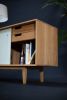 Credenza with Sliding Lacquered Doors | Media Console in Storage by Manuel Barrera Habitables. Item composed of oak wood