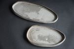 Organic natural shape elongated stoneware plates in grey | Dinnerware by Laima Ceramics. Item made of stoneware works with minimalism & contemporary style