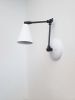 Black & White Adjustable Wall Light - Articulated Industrial | Sconces by Retro Steam Works. Item made of metal compatible with mid century modern and industrial style
