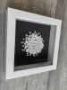 Framed black and white bookshelf decor, white on black wall | Wall Sculpture in Wall Hangings by Art By Natasha Kanevski. Item composed of canvas in minimalism or contemporary style