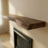 Live edge wood fireplace mantle shelf | Shelving in Storage by Ironscustomwood