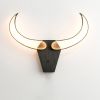 Bull skull | Sconces by Next Level Lighting. Item composed of wood and metal