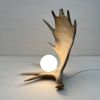 Moose Antler Lamp - Natural | Table Lamp in Lamps by Farmhaus + Co.. Item made of ceramic