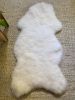 Small White Nursery Pelt | Small Rug in Rugs by East Perry. Item made of fabric