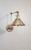 Swing Arm Adjustable Wall Light - Antique Brass | Sconces by Retro Steam Works. Item composed of metal compatible with industrial style
