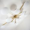 Stella Cosmos | Chandeliers by DESIGN FOR MACHA. Item composed of brass & ceramic