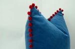 blue pillow with red pom poms // velvet pom pom pillow | Pillows by velvet + linen