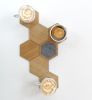 Honeycomb shape wooden coasters with magnets. Set of 7 | Tableware by DecoMundo Home. Item composed of oak wood and fabric in contemporary or industrial style