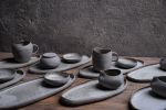 Organic natural shape elongated stoneware plates in grey | Dinnerware by Laima Ceramics. Item made of stoneware works with minimalism & contemporary style