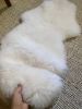 Small White Nursery Pelt | Small Rug in Rugs by East Perry. Item made of fabric