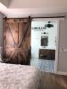 Model #1032 - Custom Barn Door | Furniture by Limitless Woodworking. Item made of maple wood works with mid century modern & contemporary style