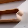 Squiggle Floating Shelves: Cherry & Ash Hardwood, Pastel Accents | Shelving in Storage by Spacecraft Furnishing