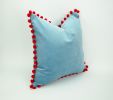 blue velvet pillow with red pom poms // blue and red pillow | Pillows by Velvet Fringe