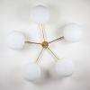 Stella Daisy | Chandeliers by DESIGN FOR MACHA. Item composed of brass and glass