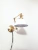 Plug in Adjustable Wall Sconce - Industrial Decor Lighting | Sconces by Retro Steam Works. Item composed of fabric and brass in industrial or modern style