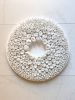 White wall sculpture on a 14" round canvas, wreath art | Wall Hangings by Natasha Kanevski. Item composed of wood & fabric compatible with minimalism and contemporary style