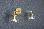 Acton | Sconces by Illuminate Vintage. Item made of brass with glass