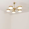 Celeste Luminescence | Chandeliers by DESIGN FOR MACHA. Item composed of brass and glass