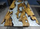 Live Edge Olive Wood Metallic White River Epoxy Table | Dining Table in Tables by LuxuryEpoxyFurniture. Item composed of wood and synthetic