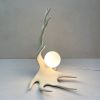 Moose Antler Lamp - White | Table Lamp in Lamps by Farmhaus + Co.. Item made of ceramic