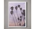 Palm trees against sunset photograph, Minimal photography | Photography by Capricorn Press. Item composed of paper